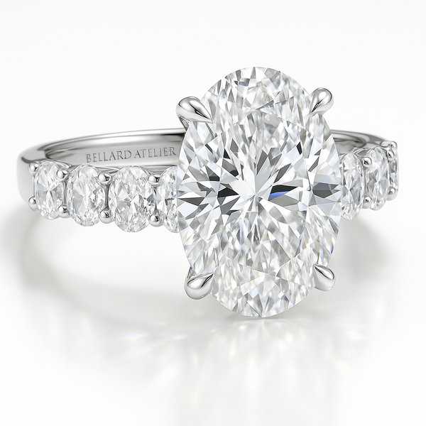 טבעת אובל 4 קארט עם שיבוץ אובל בצדדים